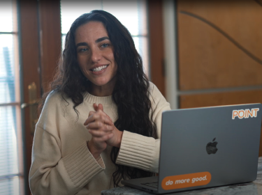 dark haired woman sitting at laptop